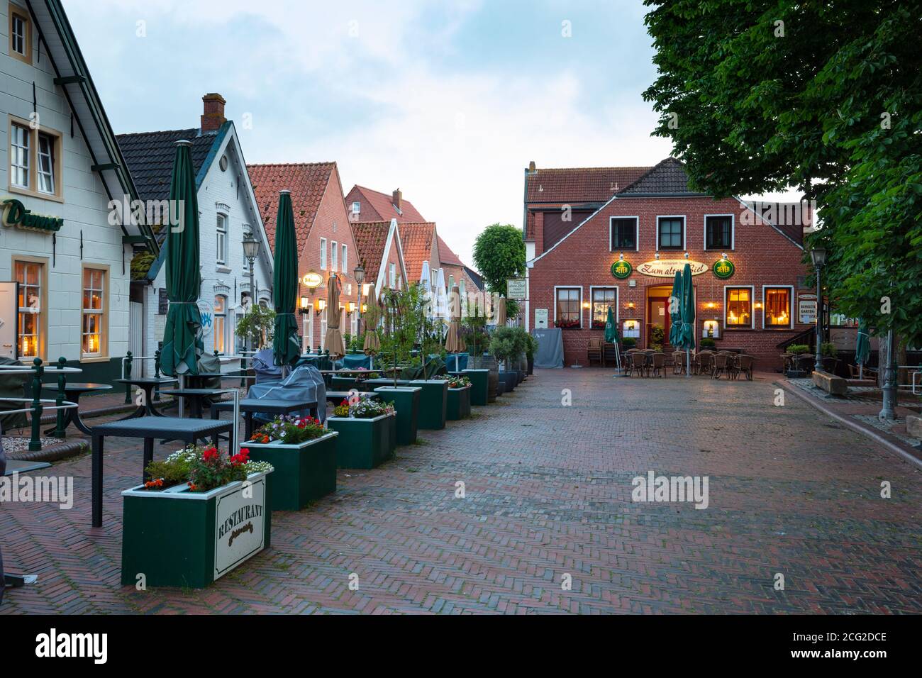 Public houses at the market by night, Greetsiel, East Frisia, Lower saxony, Germany, Europe Stock Photo