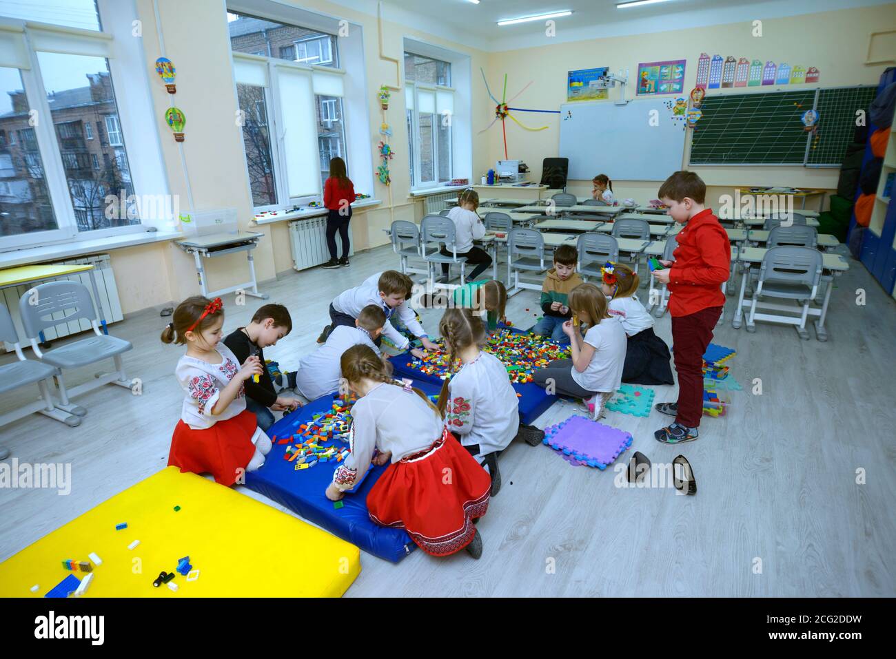 Children playing toys at the classroom of the primary school, after-school care. March 3, 2020. Kiev, Ukraine Stock Photo