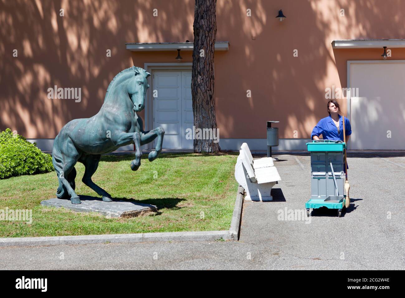 ROME - Cleaner and statue of a horse at the Cinecitta studios Stock Photo