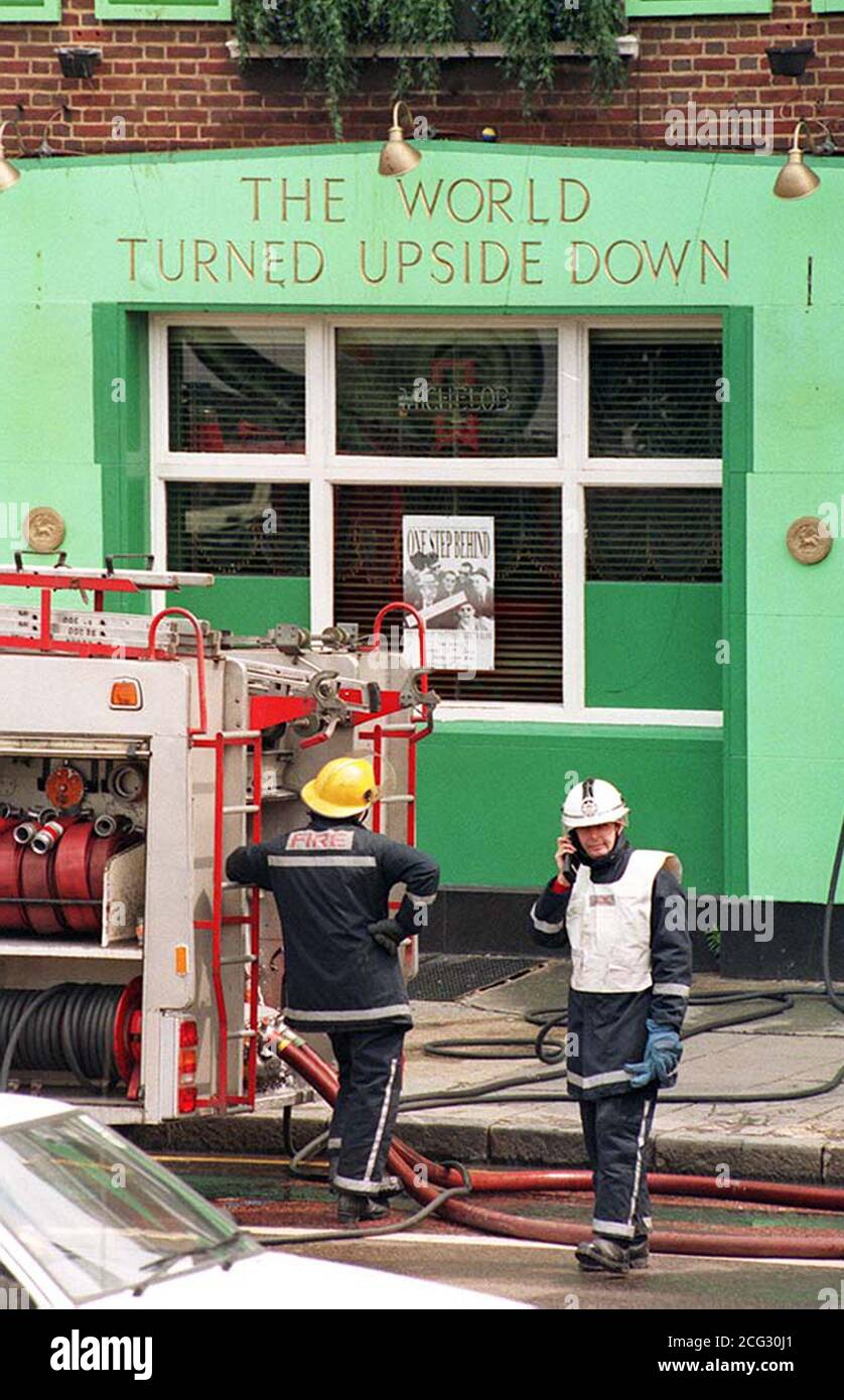 PAP 7. 18/6/85. LONDON. Firemen survey the damage to 'The World Turned Upside Down' public  house in south east London's Old Kent Road today (Sun). One man died and severals others had to be  rescued when the blaze turned the pub into an inferno and police today said they were treating the fire as  'suspicious'. See PA story DEATH Fire. Photo by Gill Allan/PA. Stock Photo