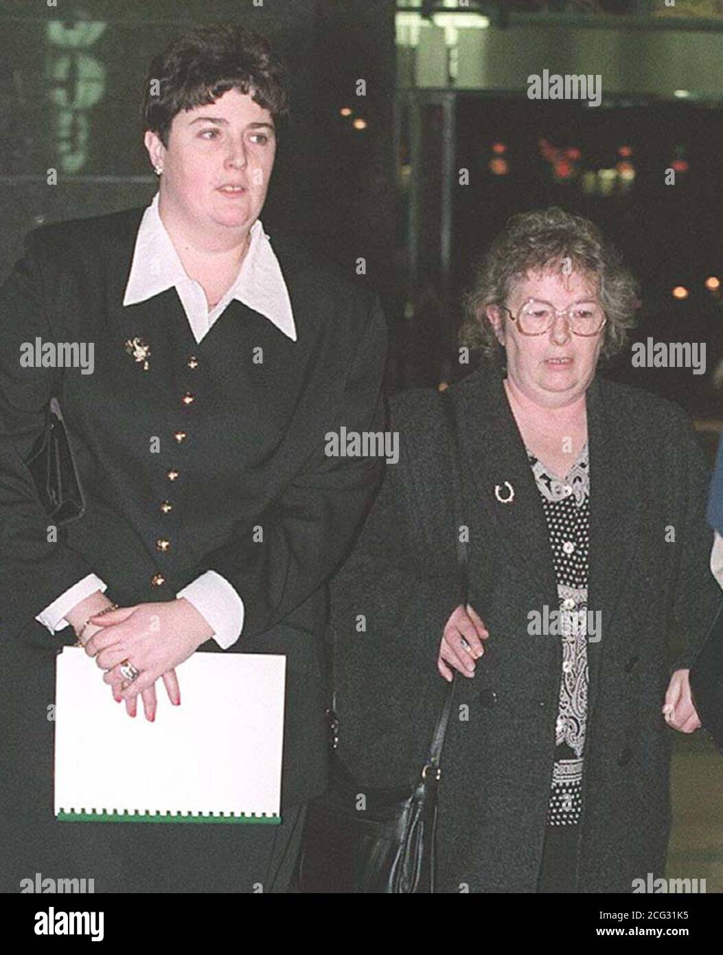 BHAM 2: BIRMINGHAM: 17.01.95: Pat Dunn leaves Birmingham County Court  today (Tuesday) with  her daughter Debbie Doyle,  where she is locked in a fierce legal battle with the mistress of her late  husband Ken Dunn,  over the right to be buried with him.  Mr Dunn died of a heart attack in 1991 in the arms  of his mistress Jean Cooper, for 16 years before his death both women shared his companionship, fully  aware of each others existence. WATCH FOR PA STORY. PA NEWS, David Jones. Stock Photo