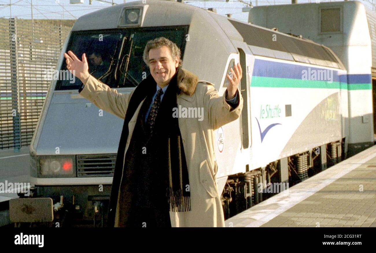 PAP FOLK 2 15.12.94. FOLKESTONE, KENT: Opera star Placido Domingo, with the Le Shuttle train which bears  his name, at Folkestone today (Thursday). Domingo, who is the eleventh opera singer to have a train named  after him, joined the train after the naming ceremony for a trip through the Channel Tunnel, to Calais.  PA News, David Giles/in.See PA story RAIL Domingo. Stock Photo