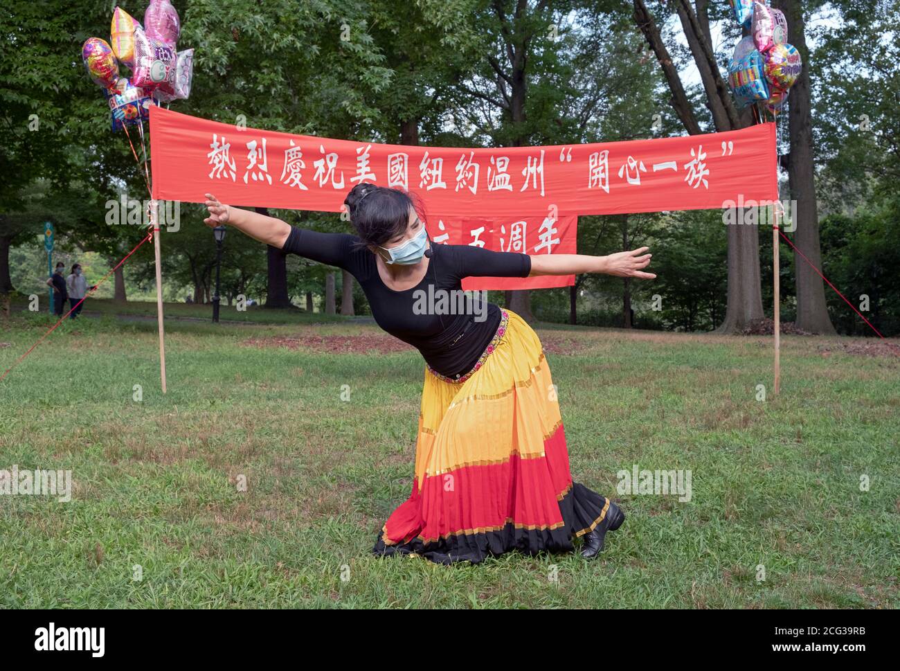 Posed portrait of the leader of a Chinese American dance group, the Wenzhou America New York troupe. At a park in Flushing, Queens, New York. Stock Photo