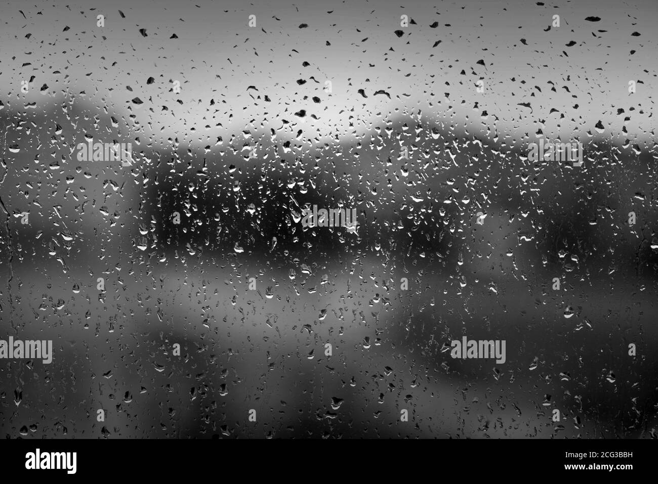 Water drops on window after heavy rain as texture or background Stock Photo