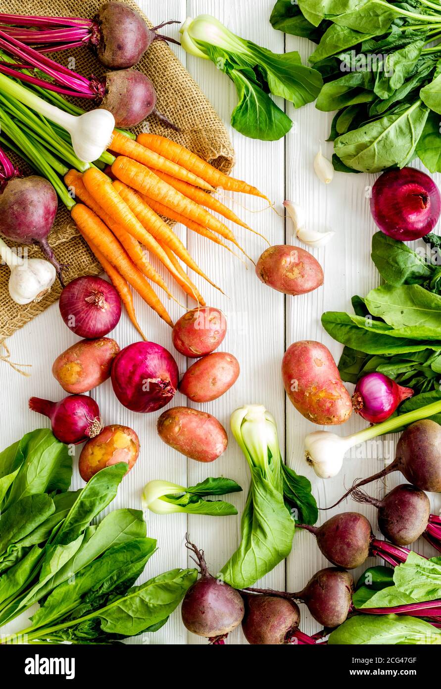 Carrot Potato Beet Onion And Spinach On White Background Top View Carrot Potato Beet Onion And Spinach On White Background Top View