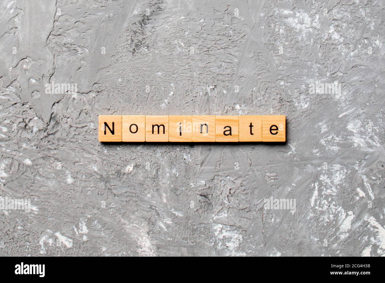 nominate word written on wood block. nominate text on table, concept. Stock Photo