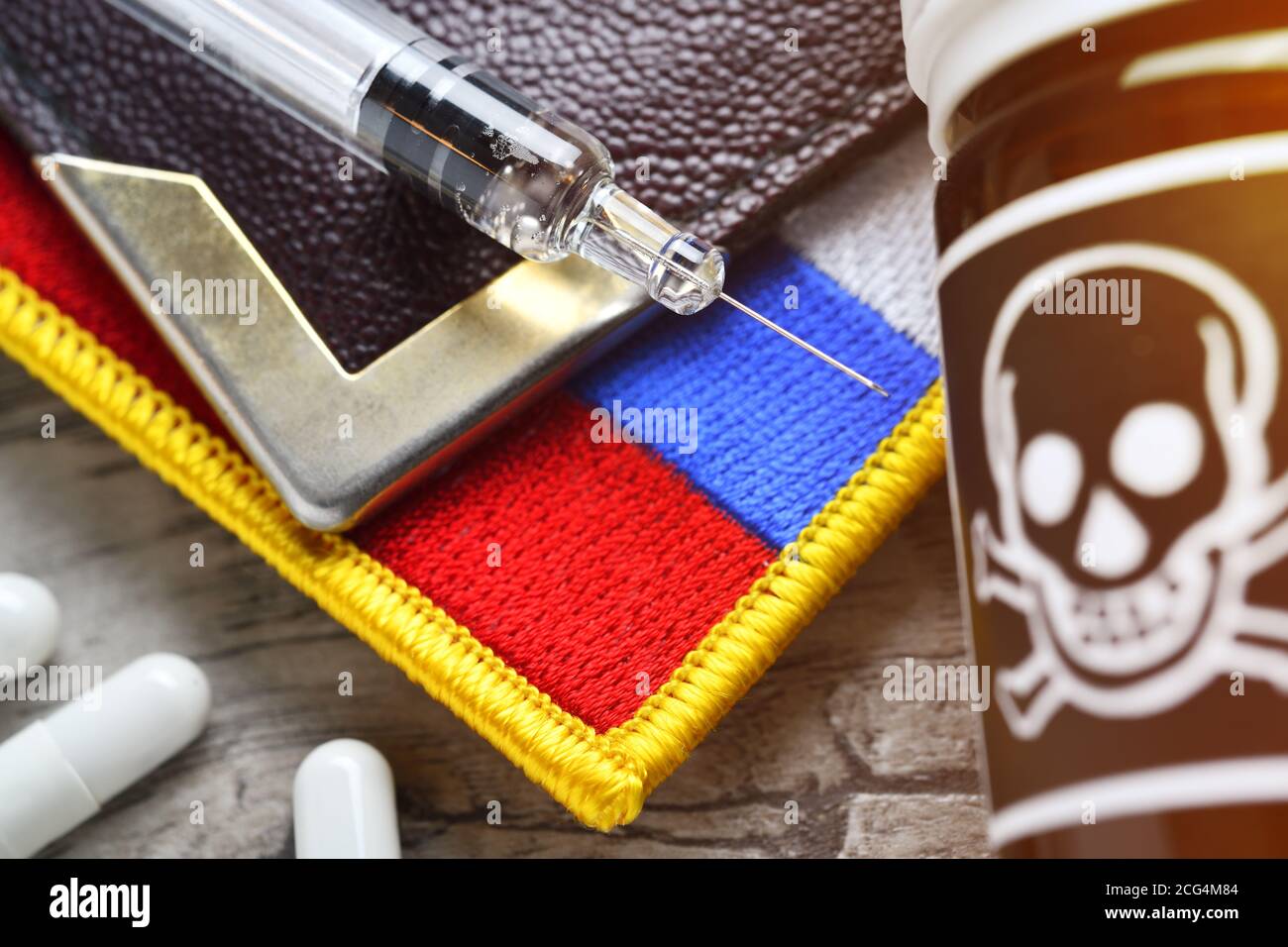 Syringe, poison vial and Russian flag, poison attack Stock Photo