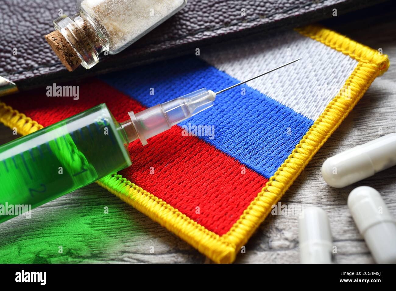 Syringe, poison vial and Russian flag, poison attack Stock Photo