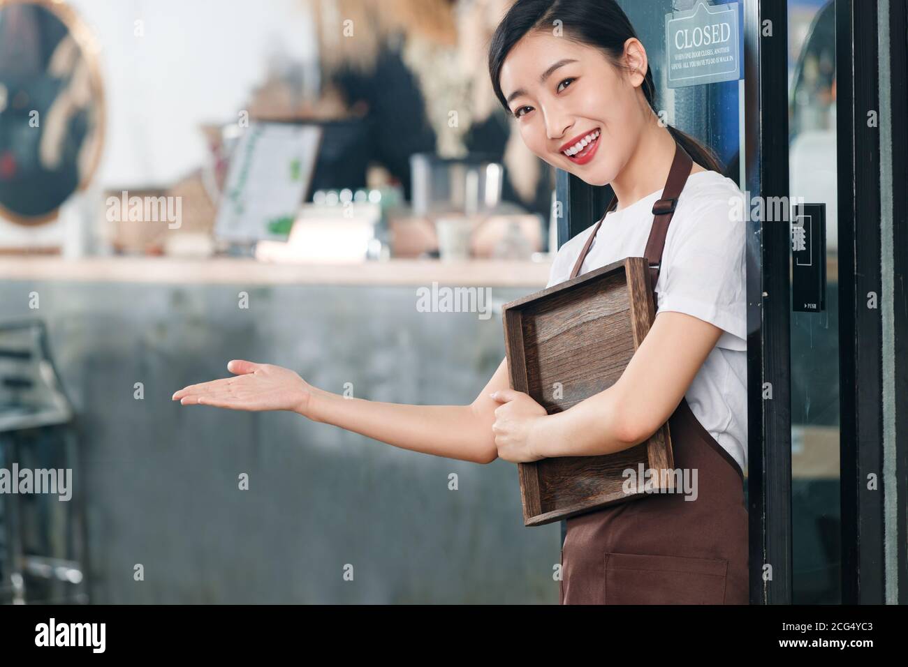 Holding a tray of coffee shop attendant Stock Photo