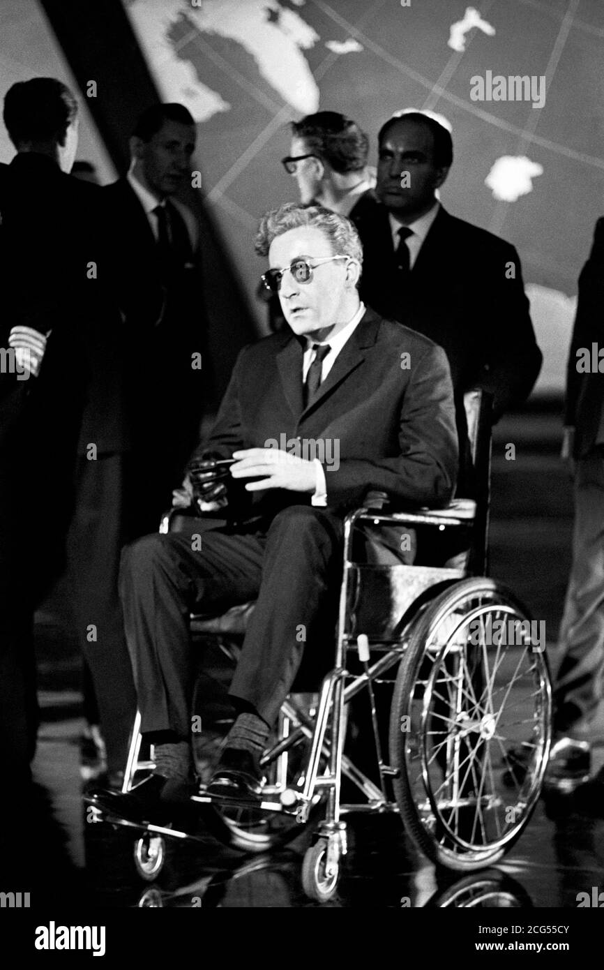 Actor Peter Sellers sits in a wheelchair portraying the titular character during production of the 1964 movie 'Dr. Strangelove or 'How I Learned to Stop Worrying and Love the Bomb', directed by Stanley Kubrick. *7/3/1999: Kubrick died today (Sunday) at his home near Harpenden, Hertfordshire. He was 70. *13/07/00: A unique collection of papers relating to Kubrick are due to be auctioned by Sotheby's. Stock Photo