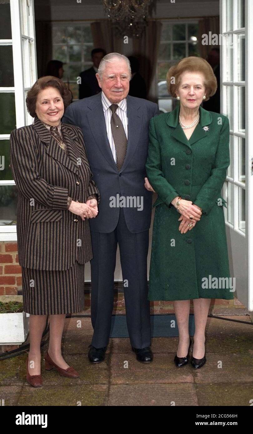 Baroness Thatcher (left) visits General Pinochet (centre) and his wife at their temporary residence where the ex-Chilean President is under house arrest at Wentworth in Surrey. Stock Photo