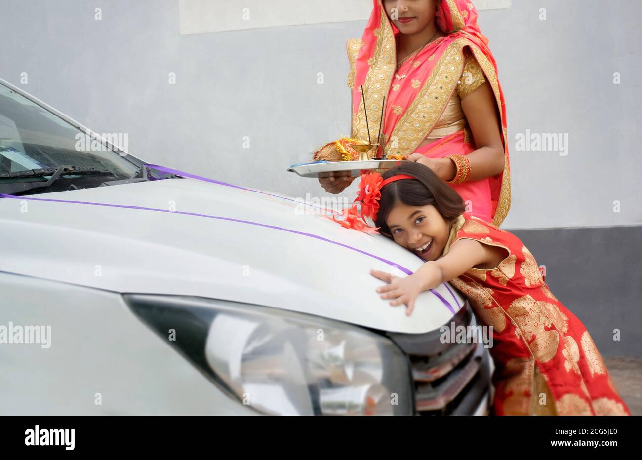 family welcoming new car making auspicious sign and rituals Stock Photo ...