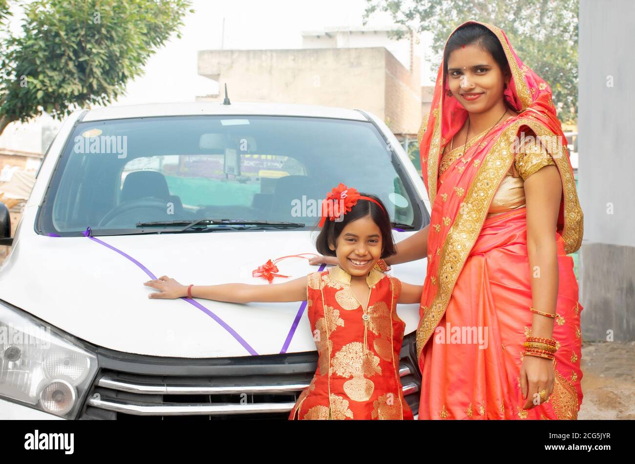 family welcoming new car making auspicious sign and rituals Stock Photo ...