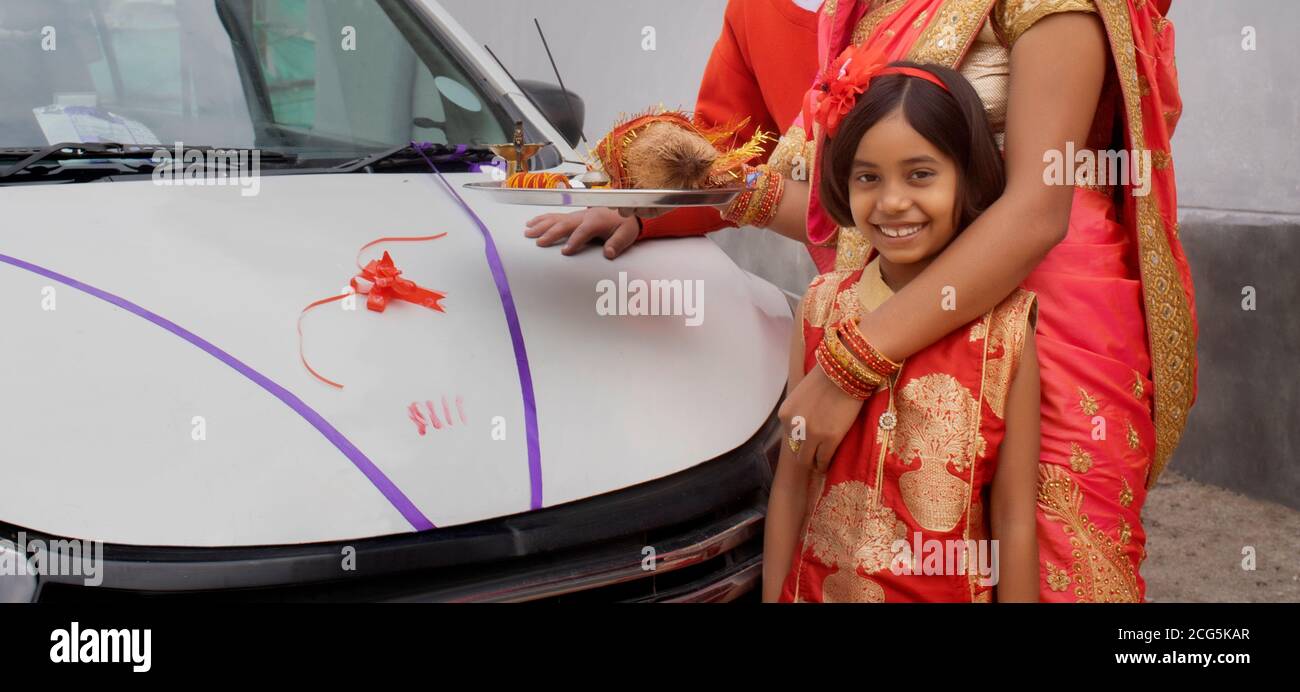 family welcoming new car making auspicious sign and rituals Stock Photo ...