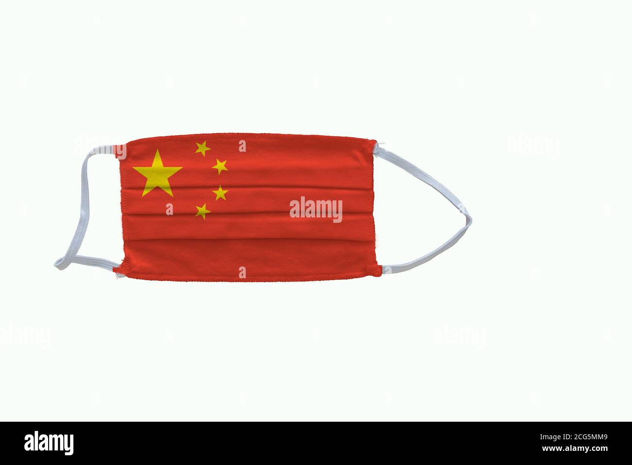 Chinese flag design Covid-19 pandemic  virus face mask  on a white background with copy space Stock Photo