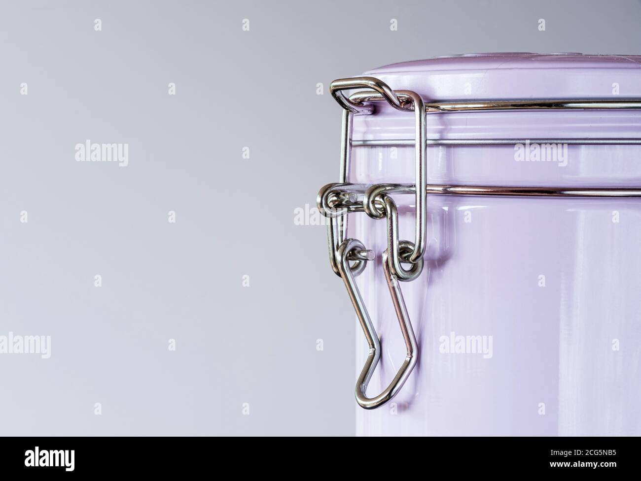 Canister with bail handle or wire ball clasp fastening on lid. Stock Photo