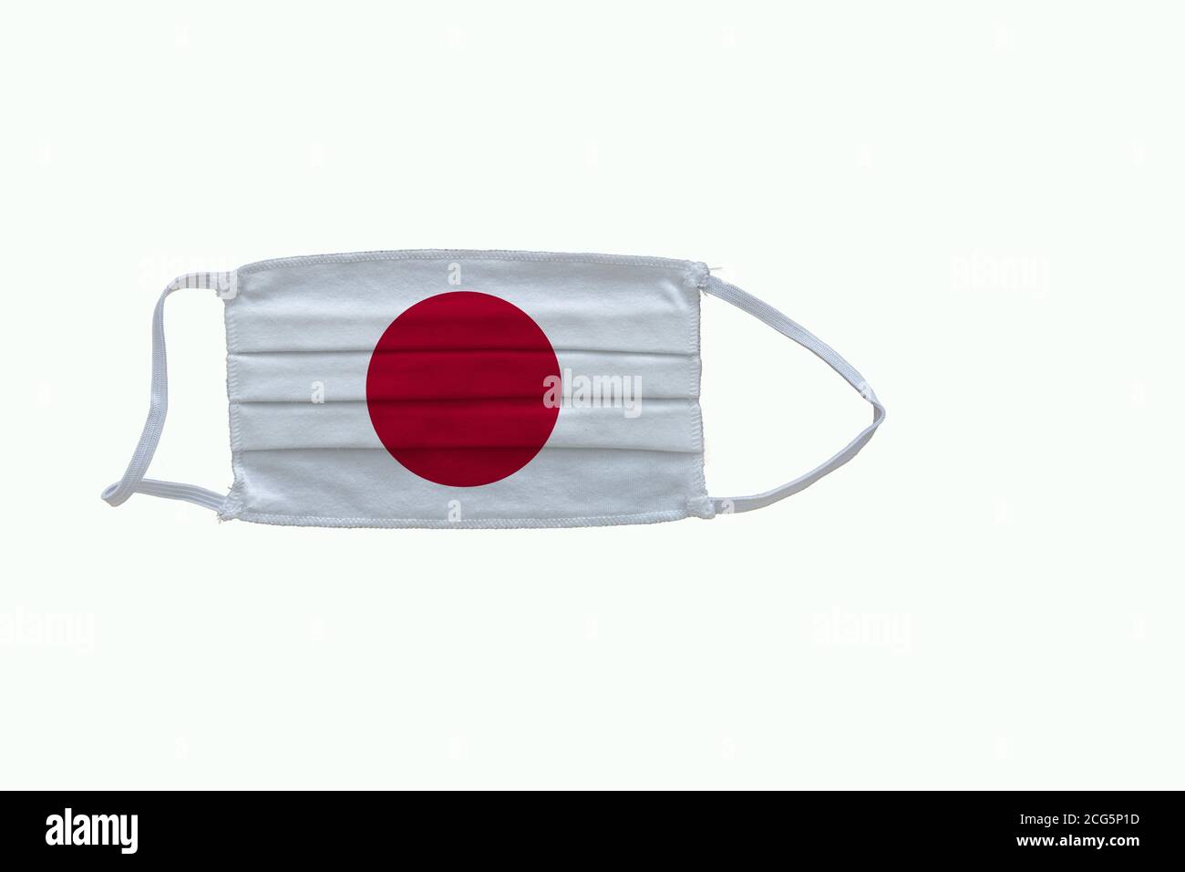 Japanese flag design Covid-19 pandemic  virus face mask  on a white background with copy space Stock Photo