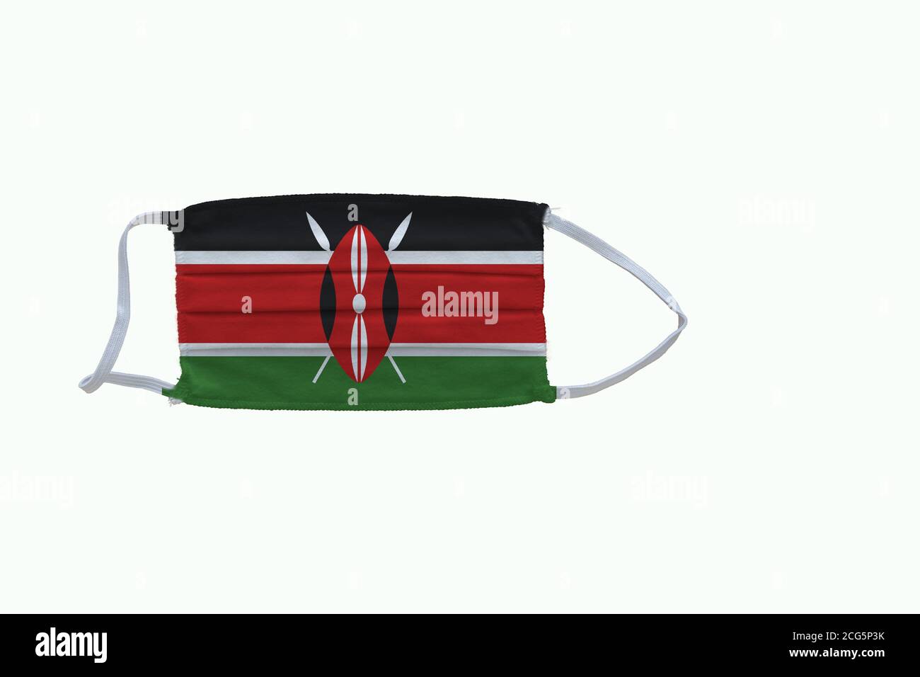 Kenyan flag design Covid-19 pandemic  virus face mask  on a white background with copy space Stock Photo