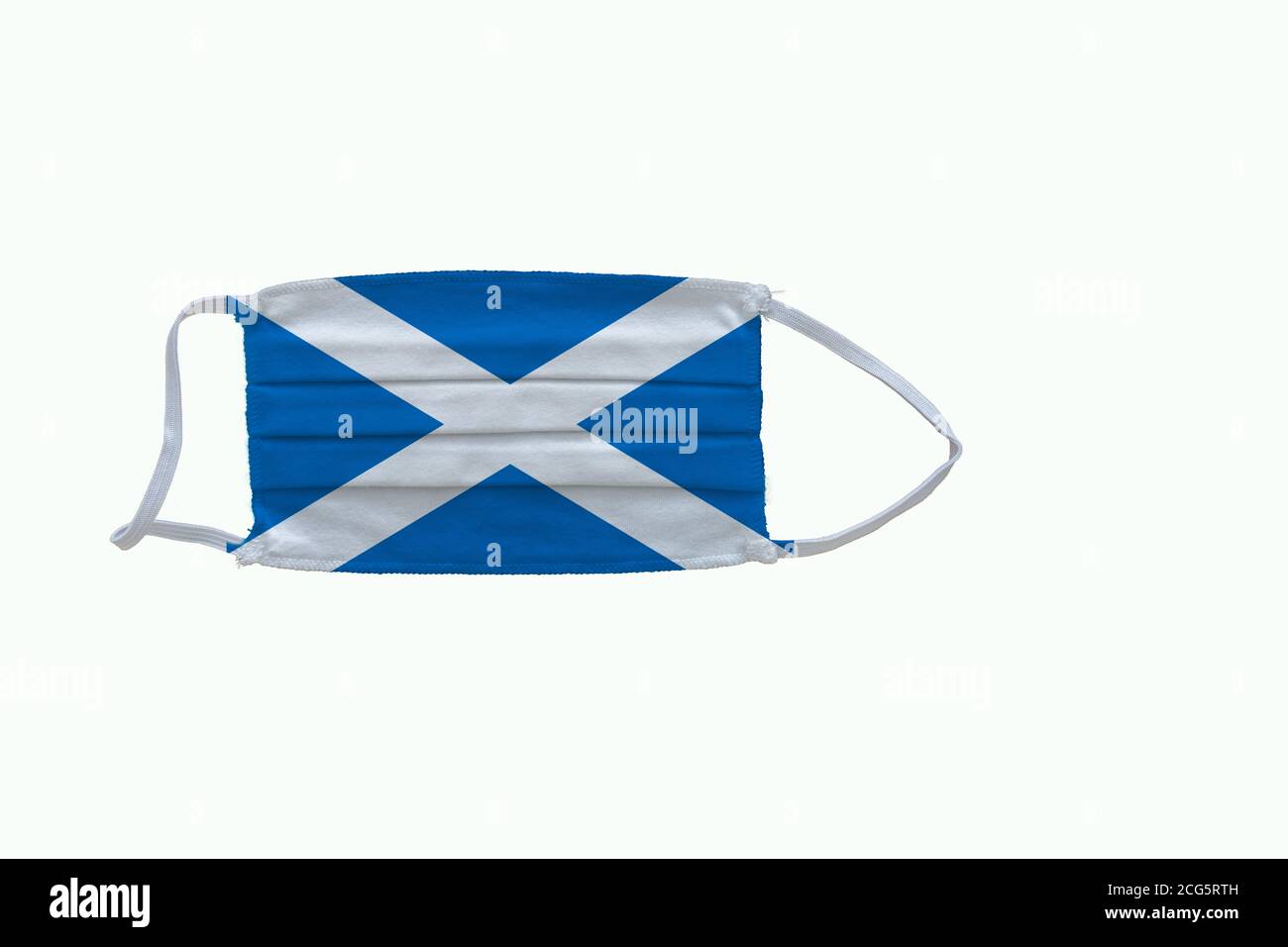 Scottish  flag design Covid-19 pandemic  virus face mask  on a white background wit Stock Photo