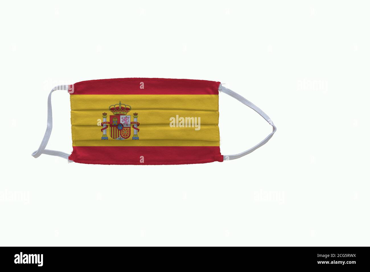 Spanish  flag design Covid-19 pandemic  virus face mask  on a white background with copy space Stock Photo