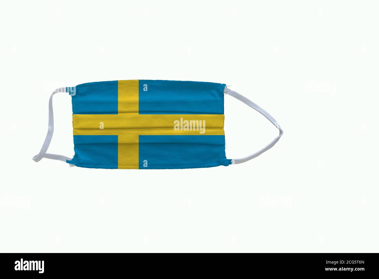 Swedish   flag design Covid-19 pandemic  virus face mask  on a white background with copy space Stock Photo