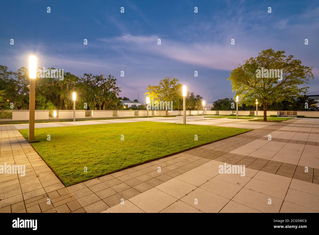 City garden with lights photo at twilight Stock Photo - Alamy