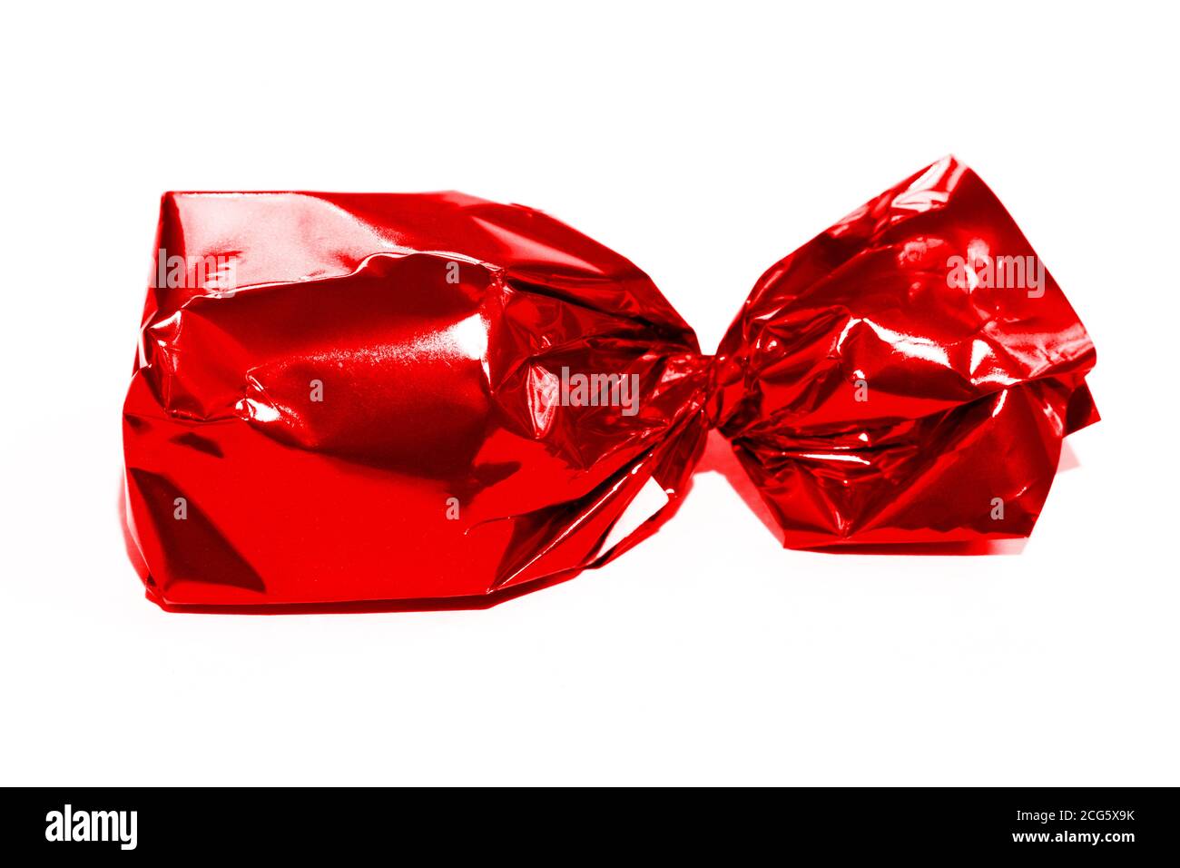 Red candy wrapped isolated on white Stock Photo - Alamy