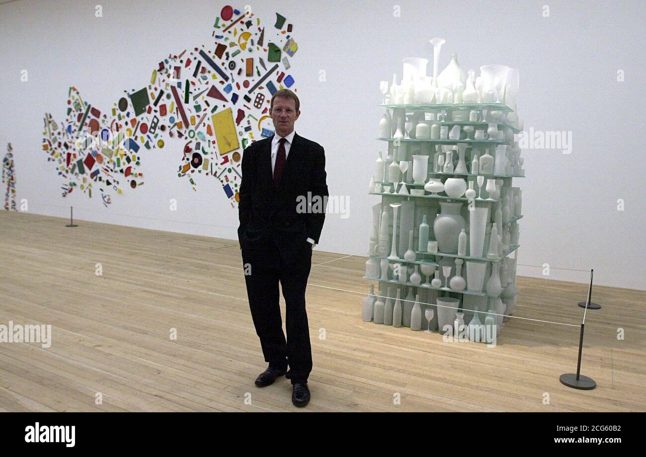 https://c8.alamy.com/comp/2CG60B2/sir-nicholas-serota-director-of-the-tate-stands-beside-art-work-cumulus-and-britain-seen-from-the-north-left-both-by-artist-tony-cragg-previewed-in-the-still-life-gallery-of-the-newly-built-tate-modern-based-on-the-south-bank-london-2CG60B2.jpg