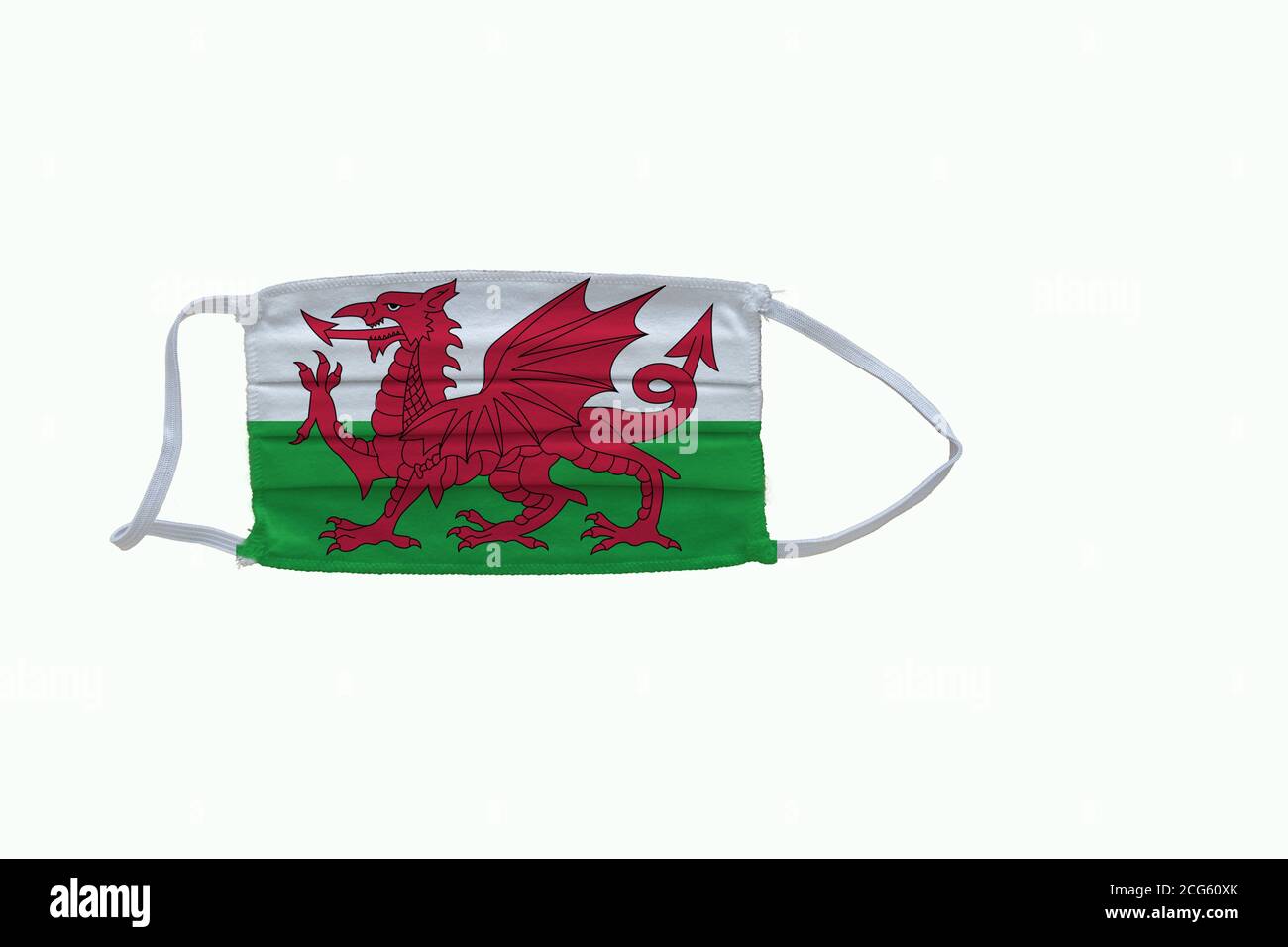 Welsh flag design Covid-19 pandemic  virus face mask  on a white background with copy space Stock Photo