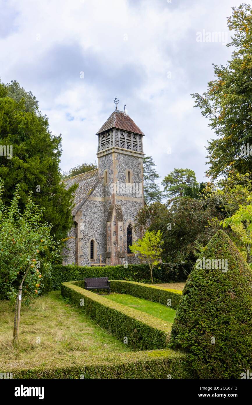 Flint walled parish church of All Saints and timber bell chamber, Hinton Ampner, Upper Itchen Benefice, Bramdean, Alresford, Hants, southern England Stock Photo