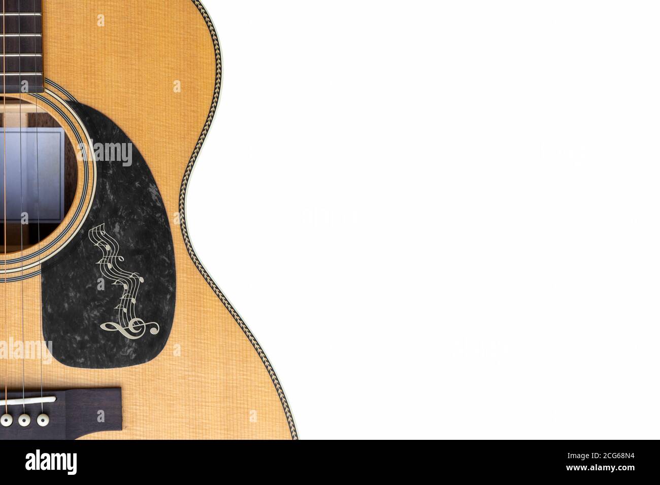 Sitka  top Acoustic guitar ornimental  pickguard on a white background with copy space Stock Photo