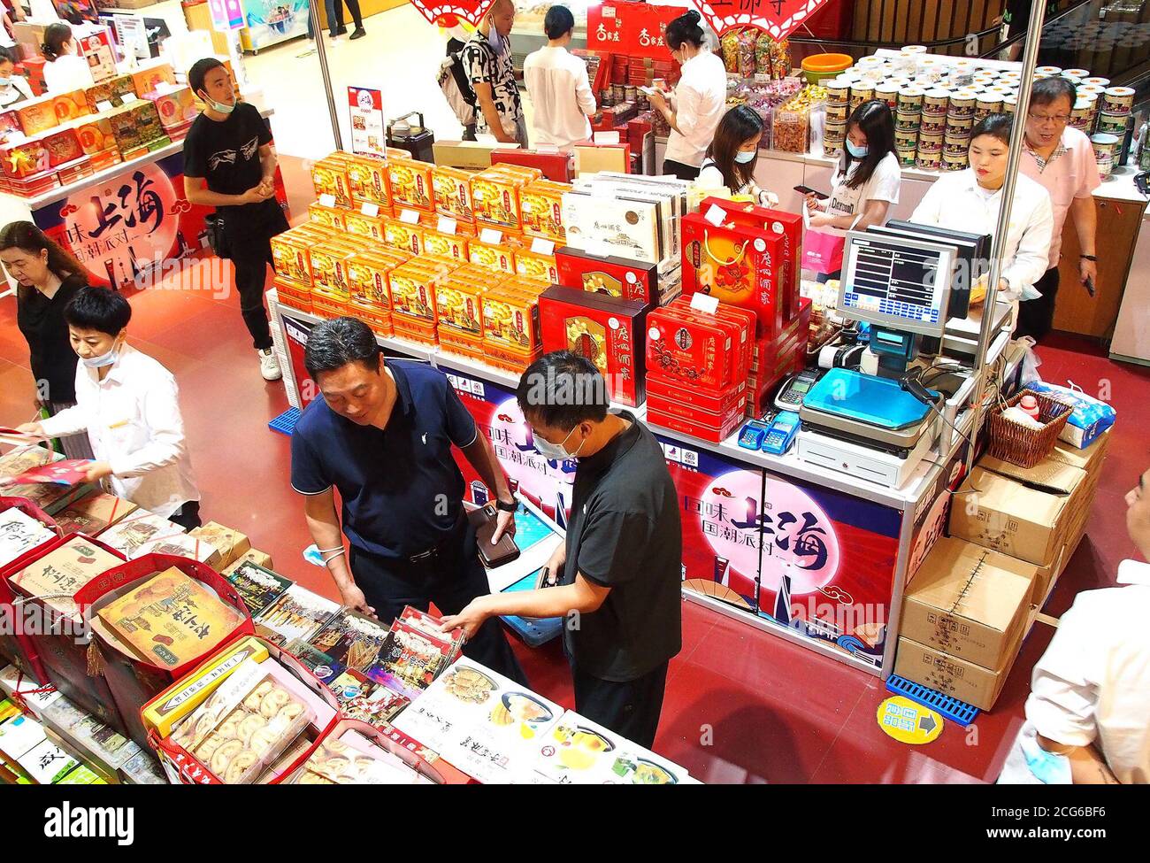 Shanghai, China. 9th Sep, 2020. Customers purchase food at a shop in Shanghai, east China, Sept. 9, 2020. China's consumer price index (CPI), the main gauge of inflation, grew 2.4 percent year on year last month, moderating from the 2.7-percent gain in July, according to data from the National Bureau of Statistics. Credit: Chen Fei/Xinhua/Alamy Live News Stock Photo