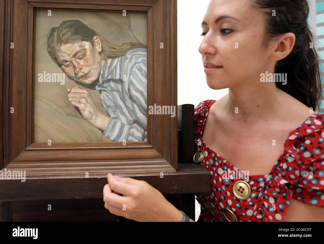 Alexandra Jacobs at Tate Britain, London, looking at the Girl In A Striped Nightdress by Lucian Freud, one of the nine works of art presented to the Tate by philanthropists Mercedes and Ian Stoutzker. Stock Photo