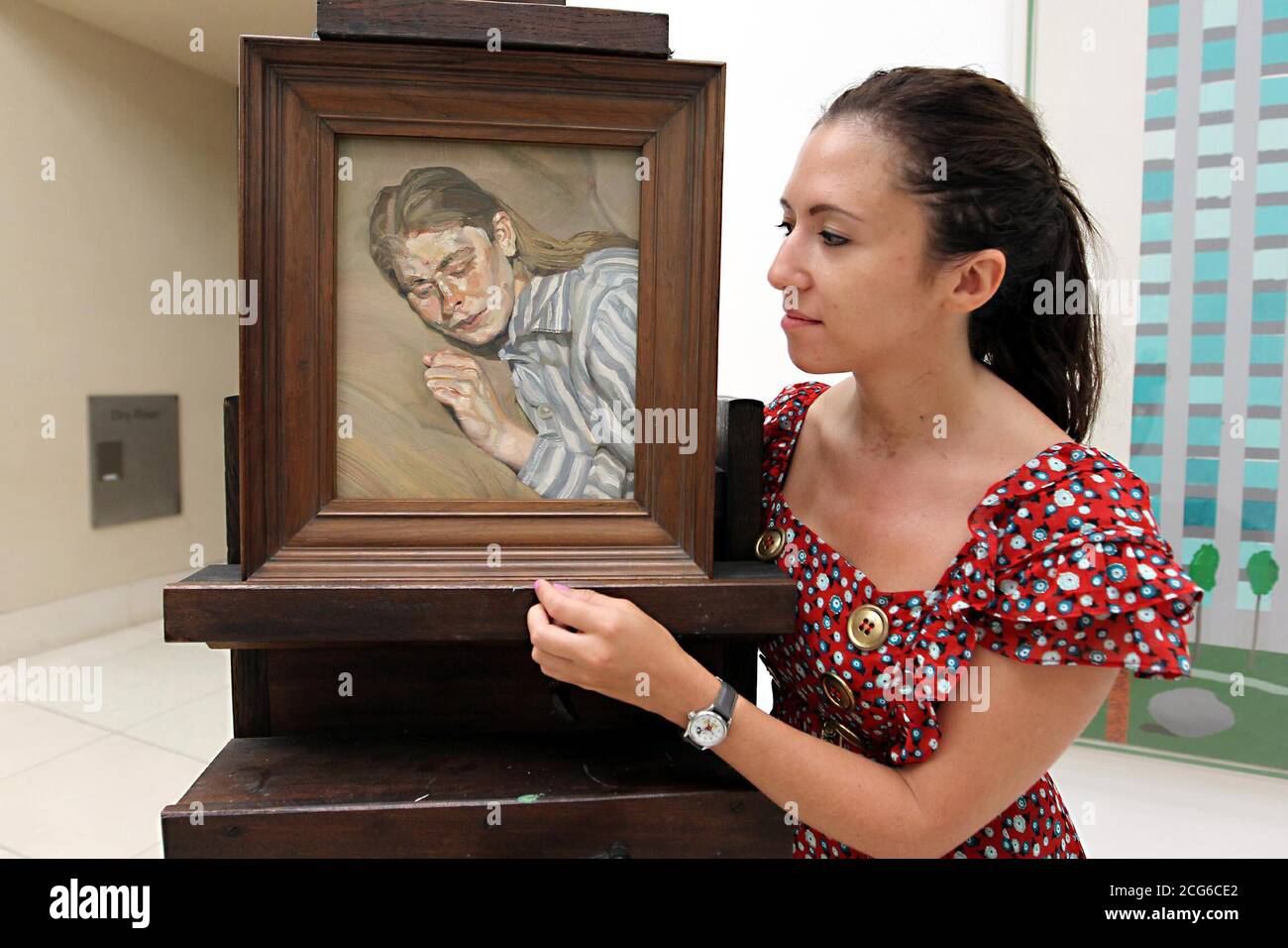 Alexandra Jacobs at Tate Britain, London, looking at the Girl In A Striped Nightdress by Lucian Freud, one of the nine works of art presented to the Tate by philanthropists Mercedes and Ian Stoutzker. Stock Photo
