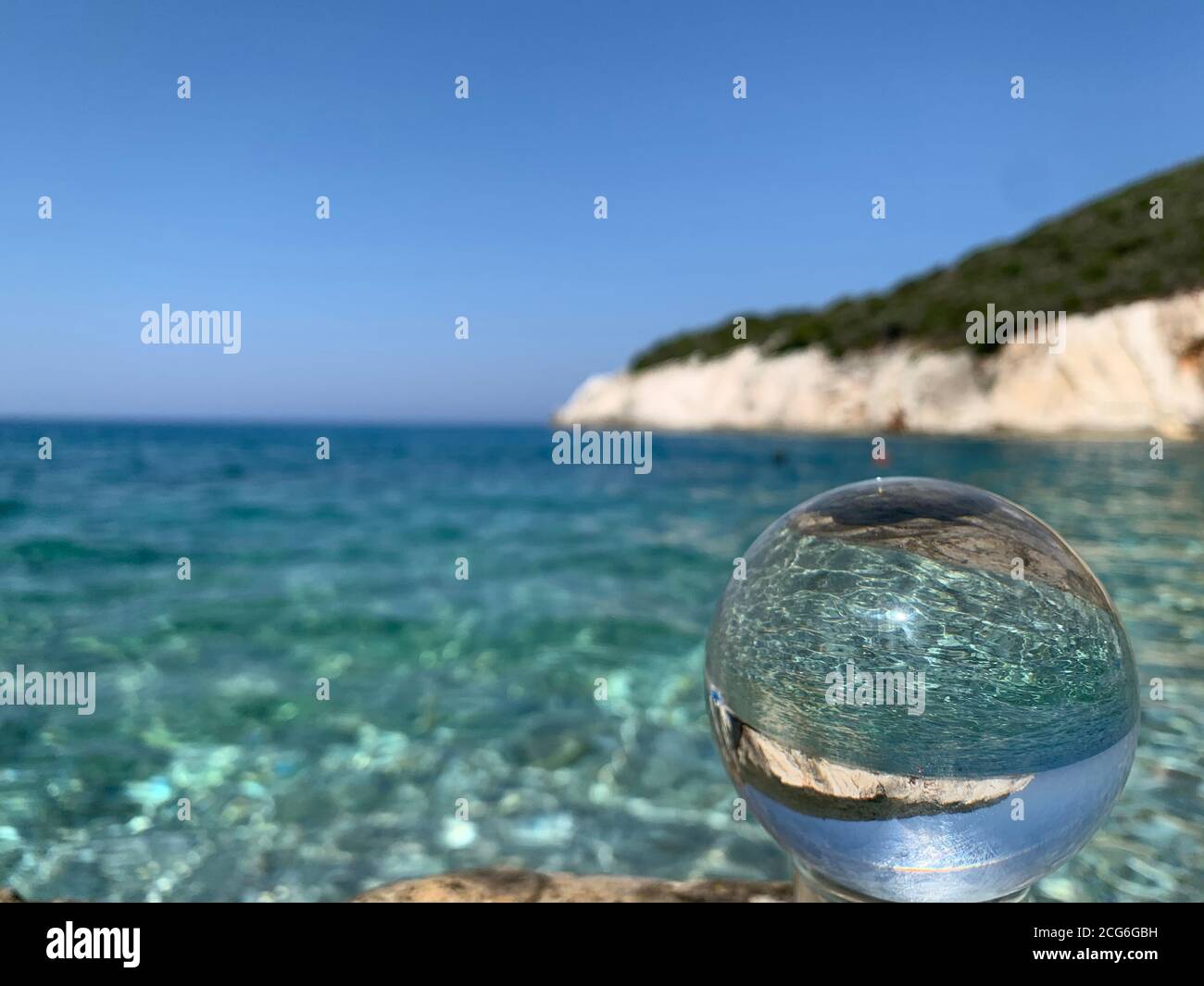 close up crystal glass ball at the beach Stock Photo Alamy