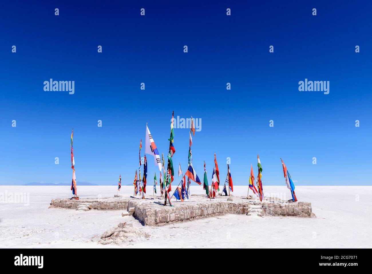 Various flags on Uyuni Salt Flat, Altiplano, Bolivia Stock Photo