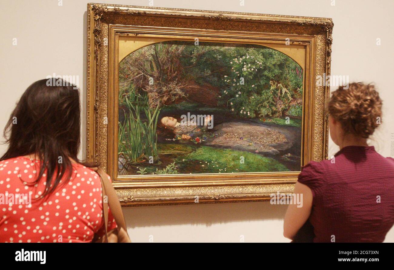 People look at Ophelia 1851-2 by John Everett Millais, the most famous work in the Pre-Raphaelites: Victorian Avante-Garde autumn show at the Tate Britain, London. Stock Photo