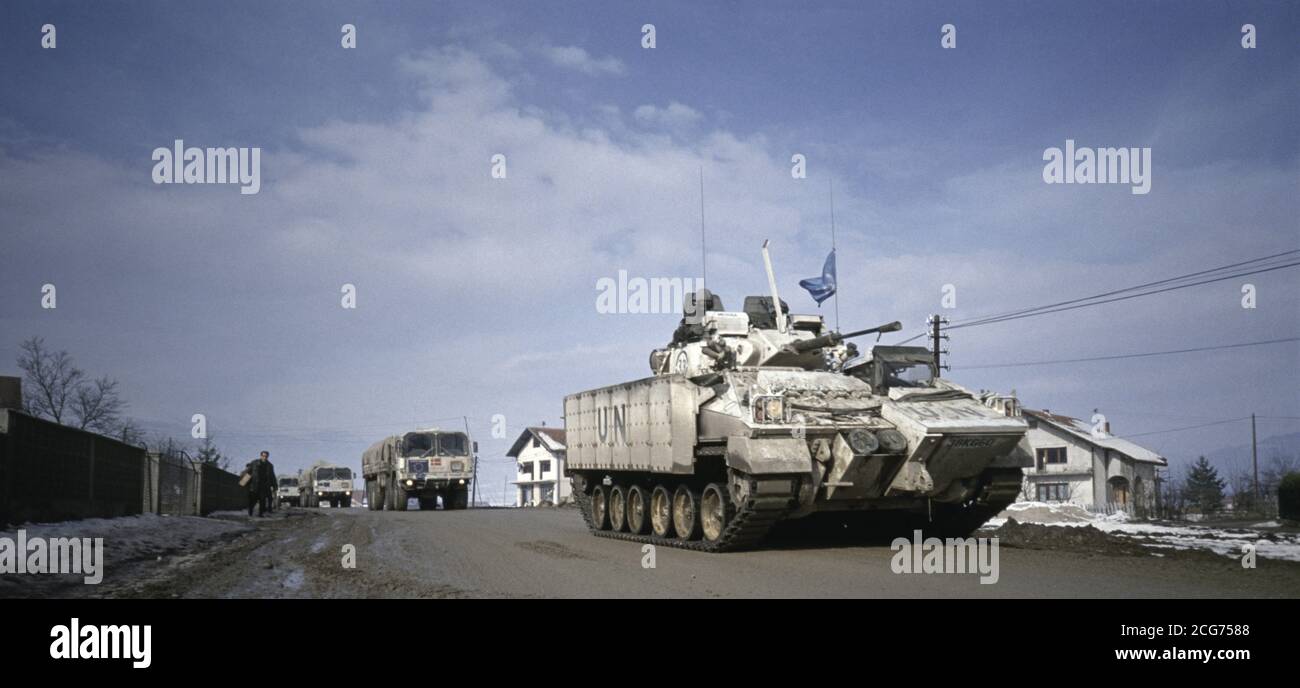 2nd February 1994 During the war in central Bosnia: outside the British Army base near Vitez, a Warrior MCV of the Coldstream Guards escorts a UNHCR humanitarian aid convoy to Zenica. Stock Photo