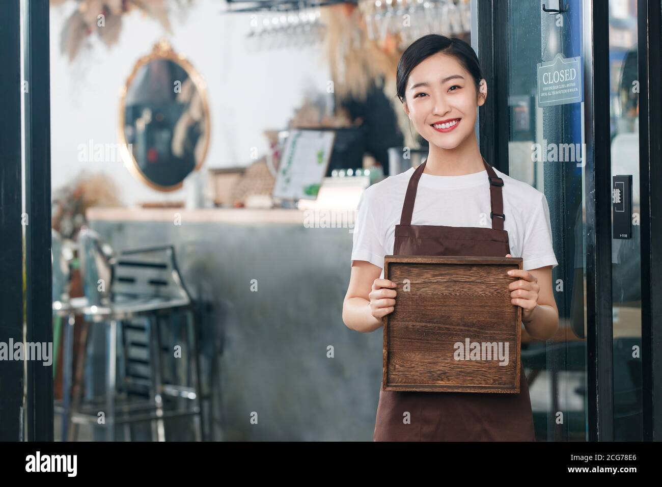 Holding a tray of coffee shop attendant Stock Photo