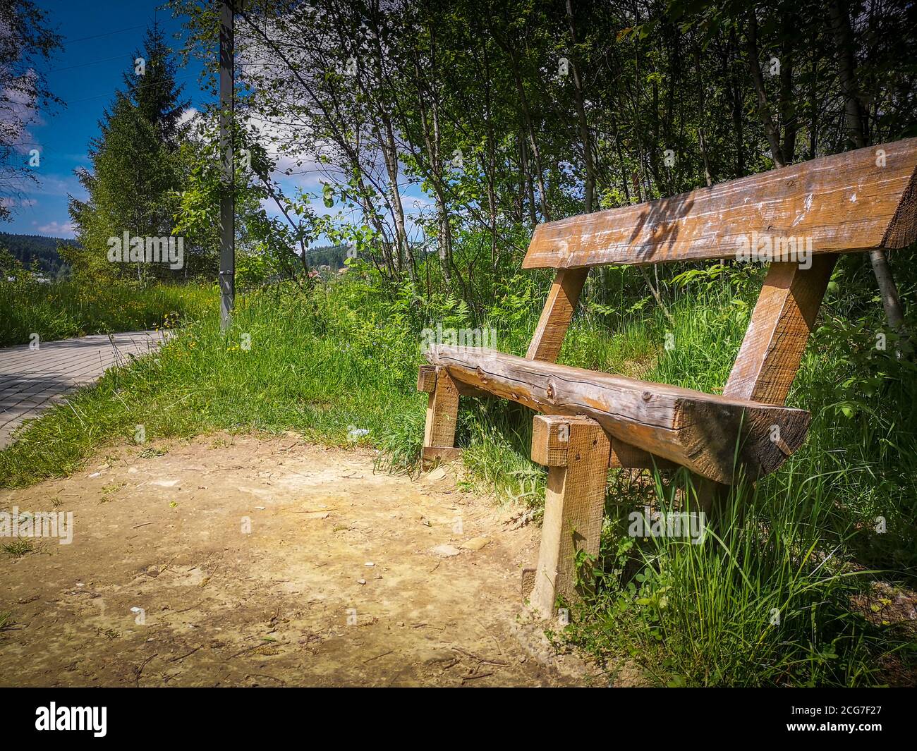 Empty bench in park side hi-res stock photography and images - Alamy