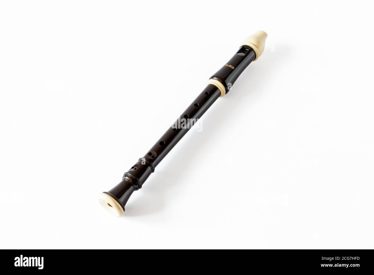 An Aulos brand plastic soprano recorder isolated on a white background Stock Photo