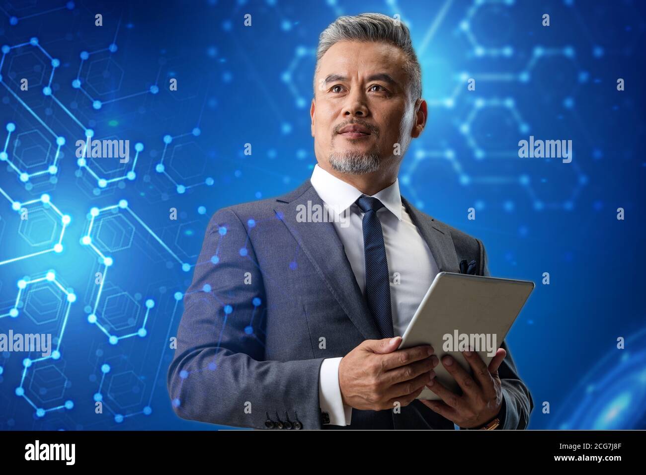 Holding a tablet business man Stock Photo