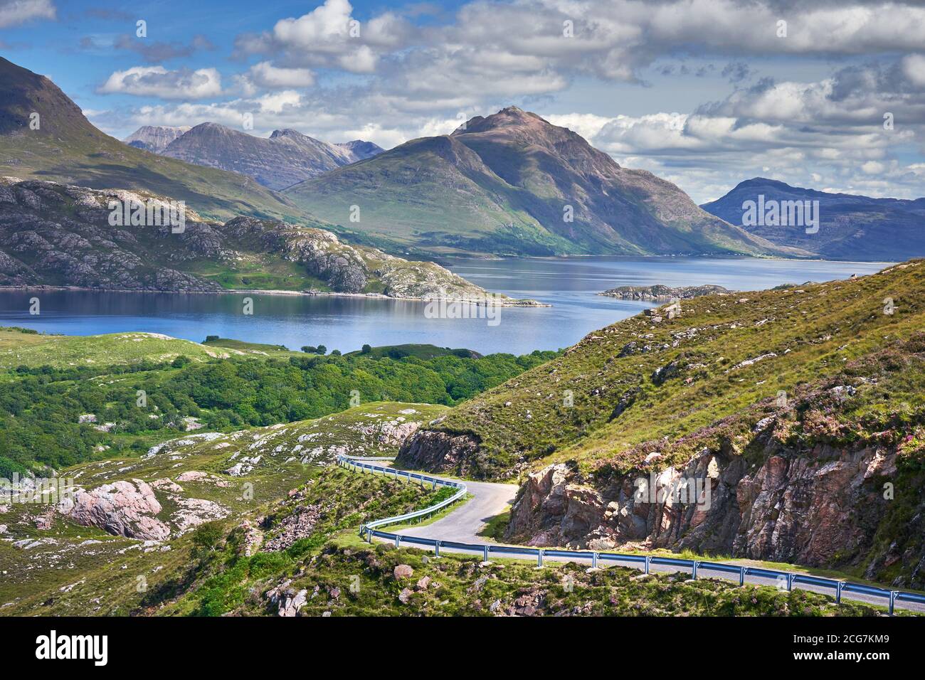North Coast 500 route near Ardheslaig Applecross Peninsula with Torridon mountains in background Wester Ross Scotland Stock Photo