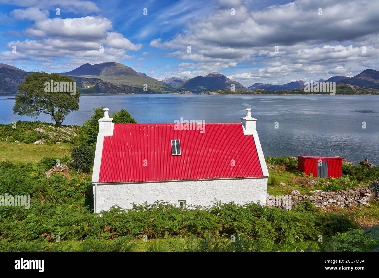 North Coast 500 route near Ardheslaig Applecross Peninsula with Torridon mountains in background Wester Ross Scotland Stock Photo