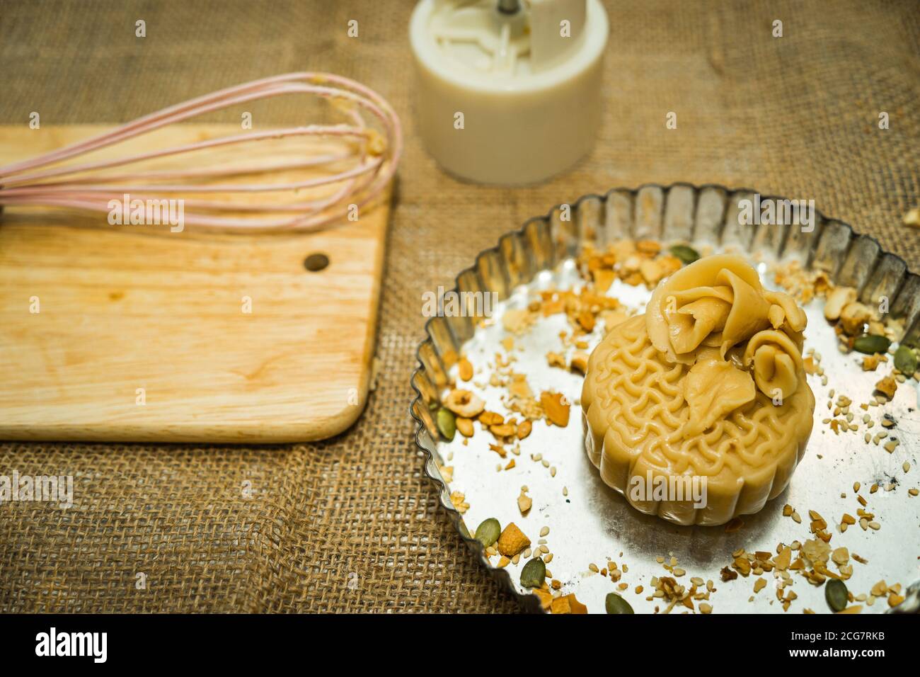 the wooden mold for moon cake, homemade cantonese moon cake pastry on baking tray before baking for traditional festival. Travel, holiday, food concep Stock Photo