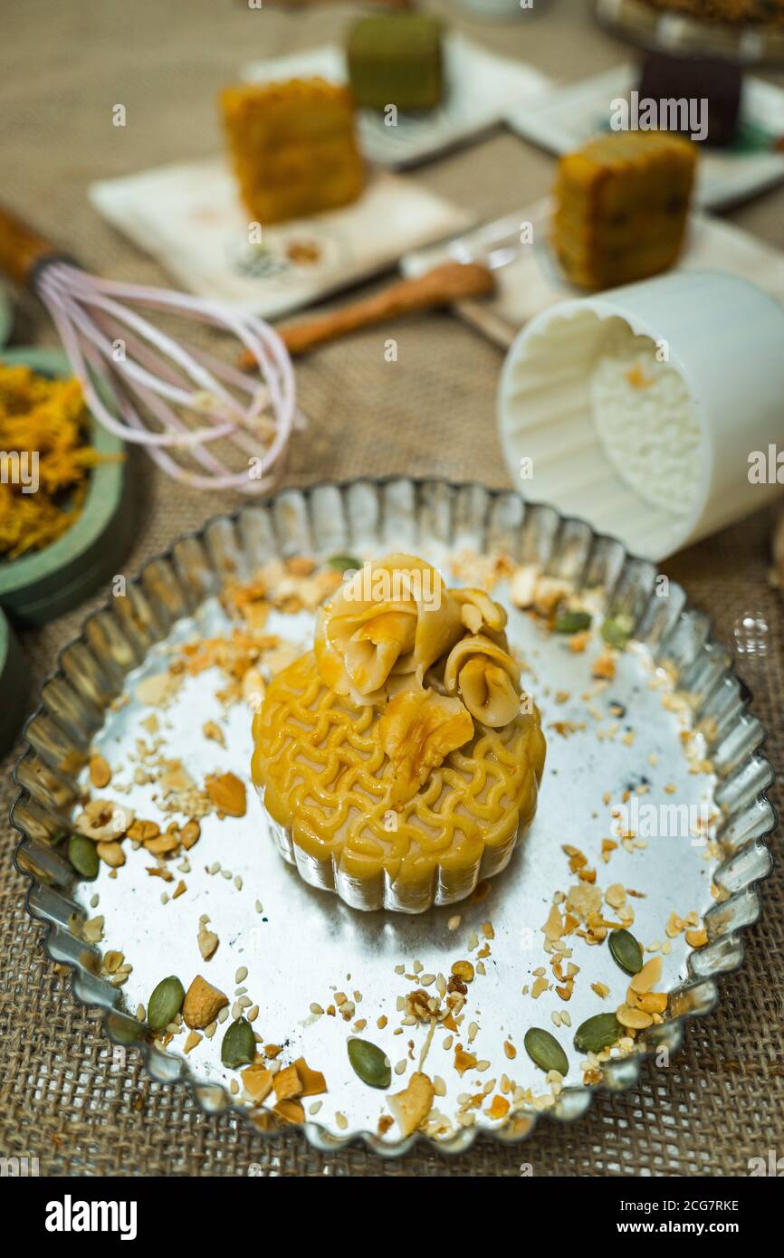 the wooden mold for moon cake, homemade cantonese moon cake pastry on baking tray before baking for traditional festival. Travel, holiday, food concep Stock Photo