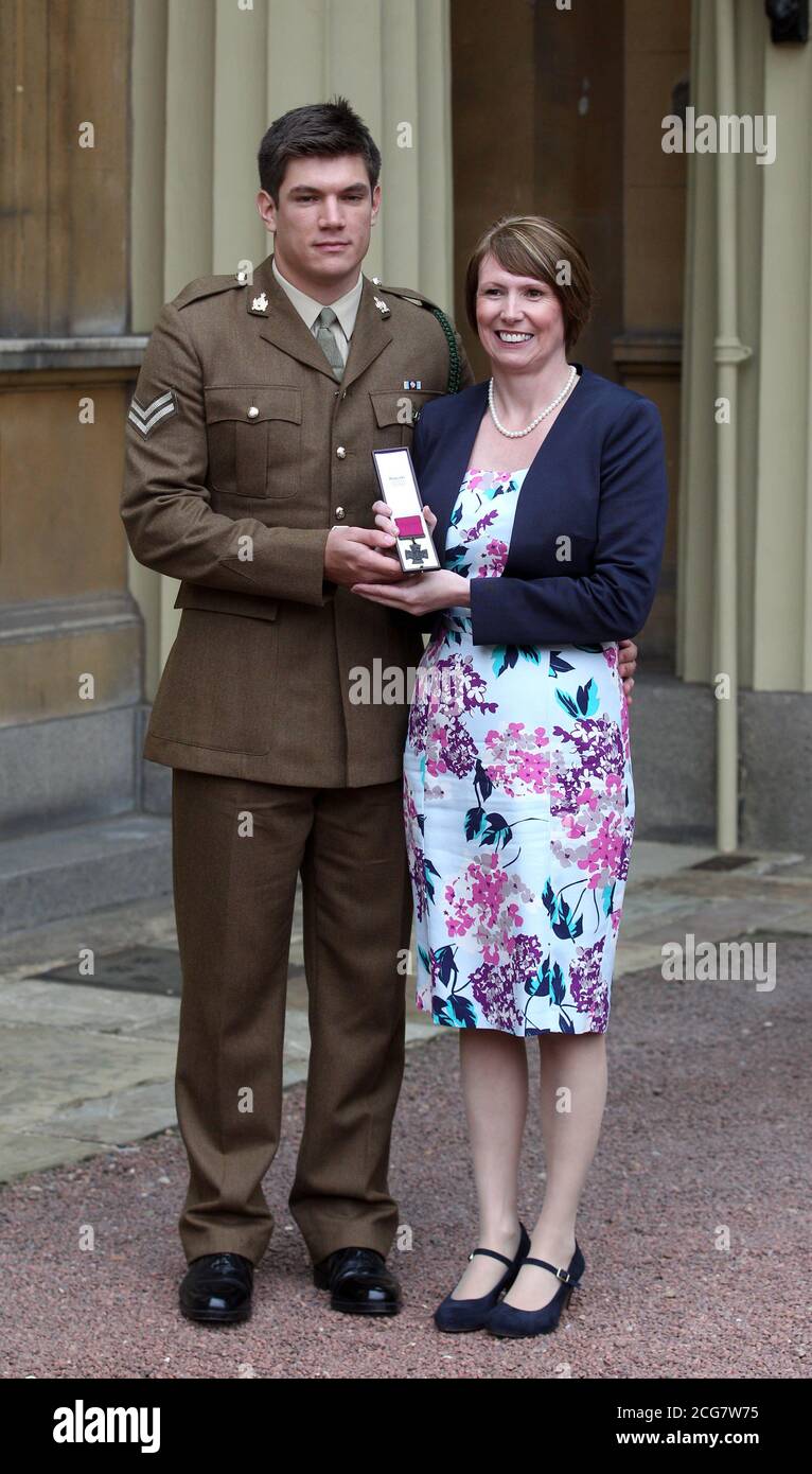 WPA ROTA Mrs Kerry Ashworth who received the Victoria Cross conferred on her late son, Lance Corporal James Ashworth, at Buckingham Palace, with her other son Coran. PRESS ASSOCIATION Photo. Picture date: Tuesday May 21, 2013. See PA Story. Photo credit should read: Lewis Whyld/PA Wire. Stock Photo