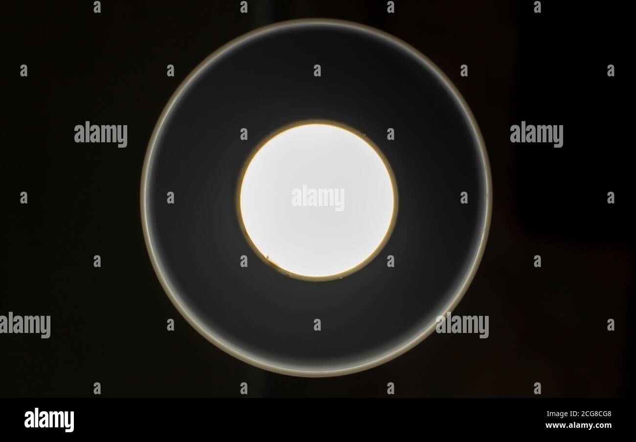 White glowing circles on a black background.  Stock Photo