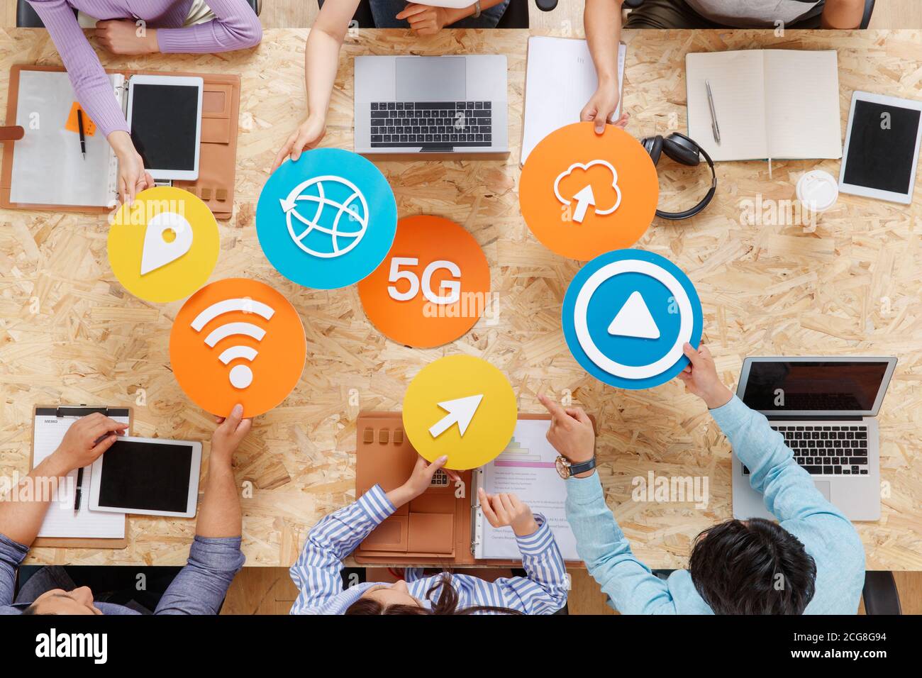 Office workers face to face with symbolic ICONS Stock Photo