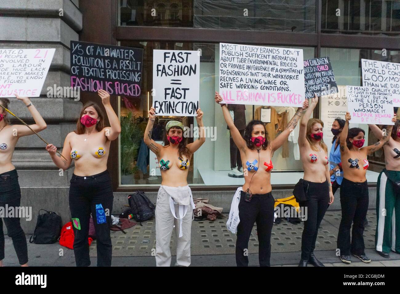 London, UK. 09th Sep, 2020. London, UK. Members of the Extinction Rebellion environmental campaign group stage a protest inside a shop window to protest against fashion industry in H&M at Oxford Street in central London. Photo Credit: Ioannis Alexopoulos/Alamy Live News Stock Photo